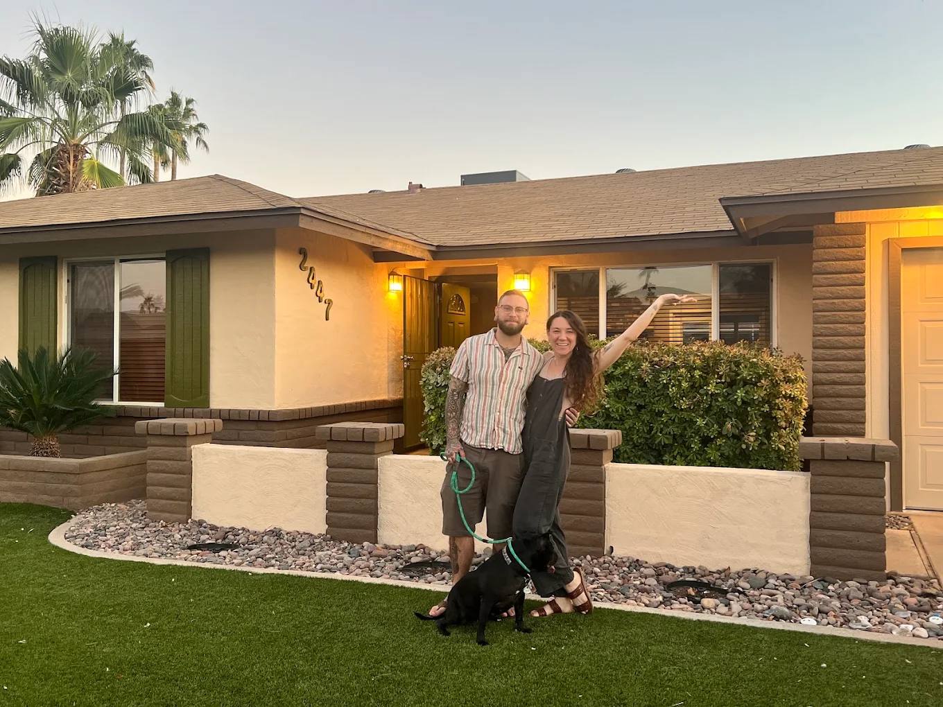 Clients in front of the Phoenix home they just bought